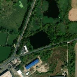 Satellite imagery of [Havraň] former suger factory chimney, CZ