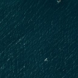 Satellite imagery of Jument Rock, JE