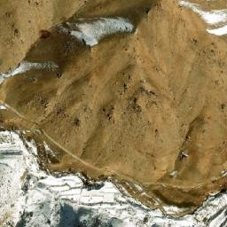 Satellite imagery of Ghūnḏī-ye Garm Āwak, AF