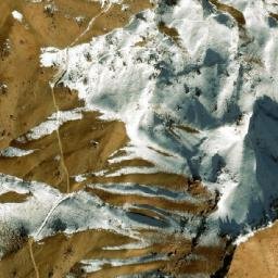 Satellite imagery of Ghūnḏī-ye Garm Āwak, AF