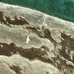 Satellite imagery of Ra’s Qirţās, QA