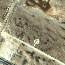 Satellite imagery of Ra’s Qirţās, QA